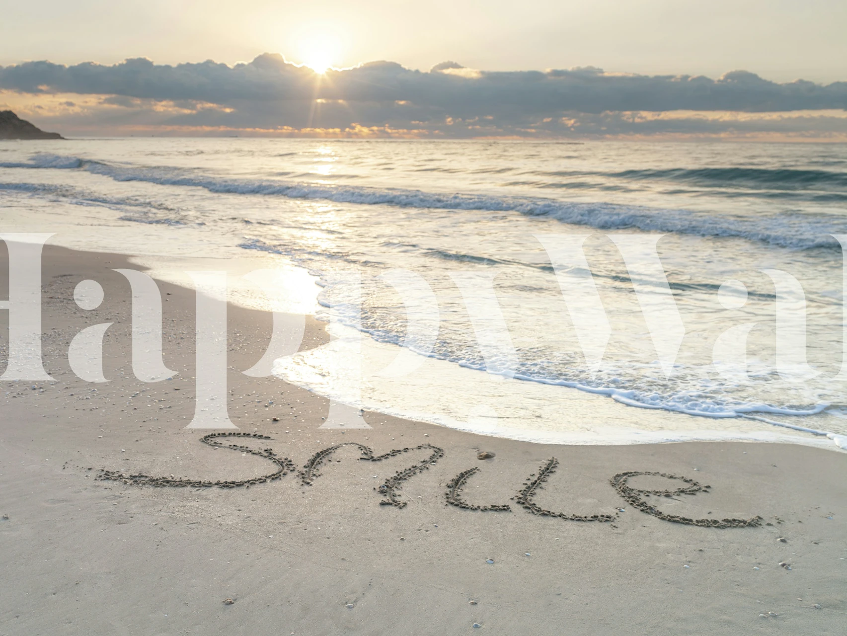 Seaside sunrise with smile written in the sand on happywall.com