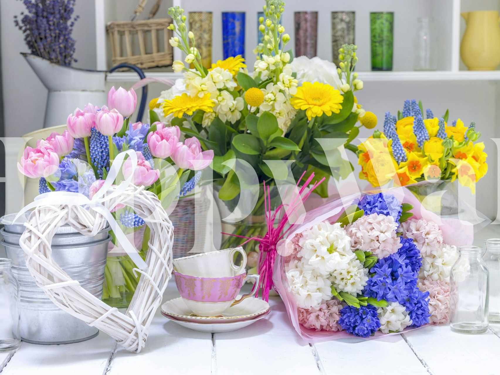 Wallpaper featuring flowers and cups in a room
