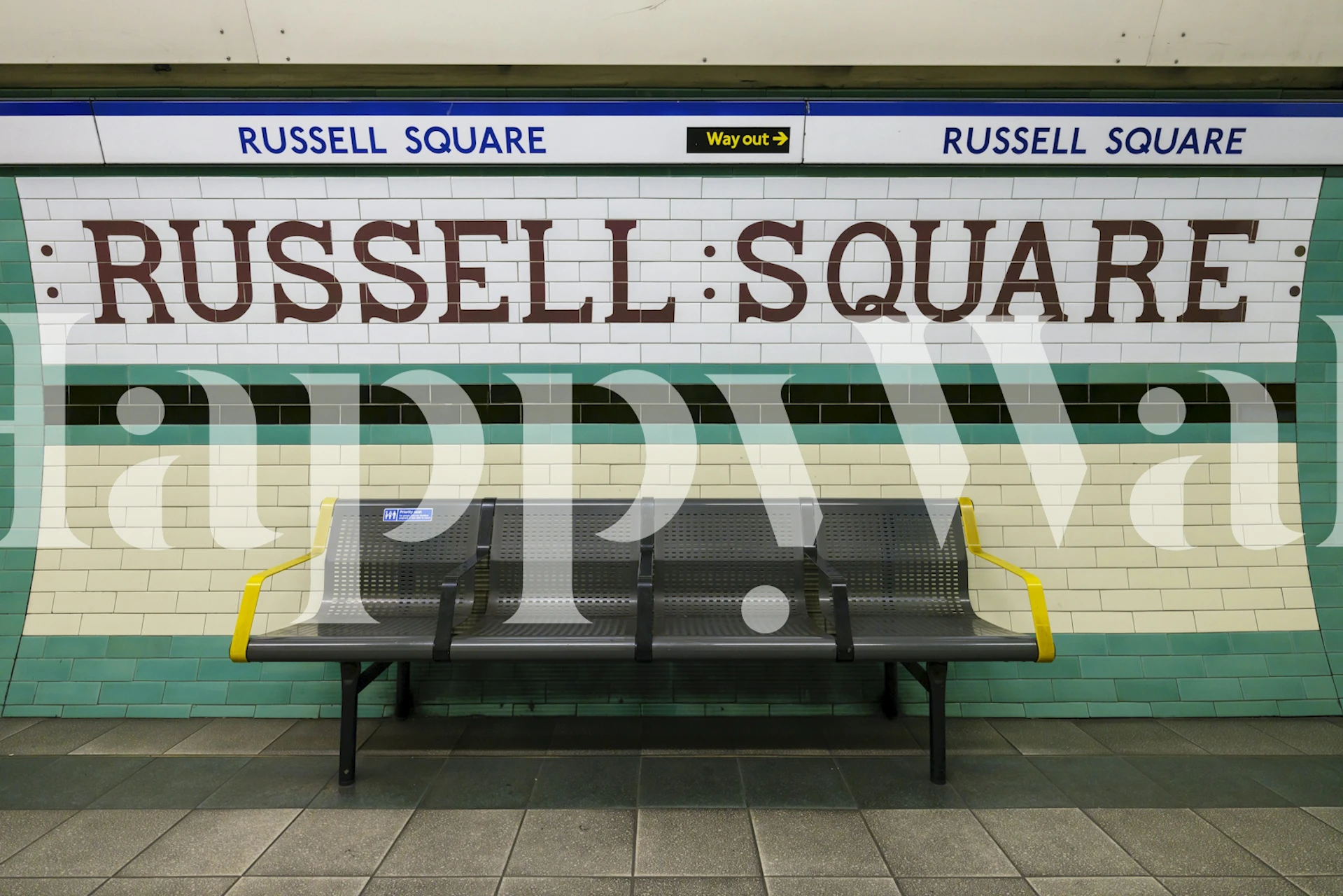 Green and white tiled wall with Russell Square signage wallpaper