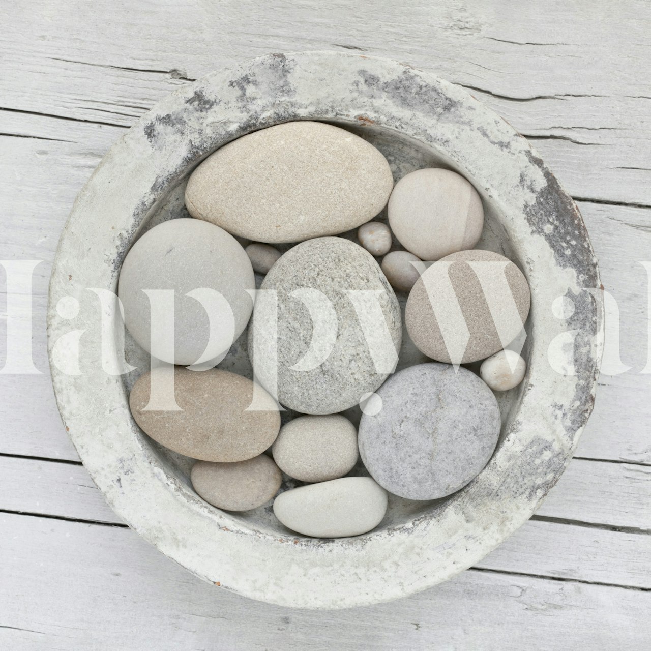 Zen pebble bowl with assorted stones in neutral tones wallpaper