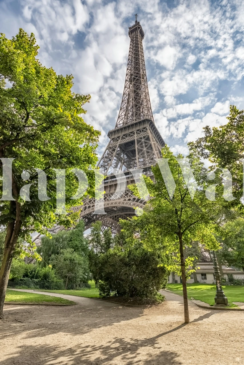 Eiffel Tower surrounded by lush green trees and blue sky wallpaper