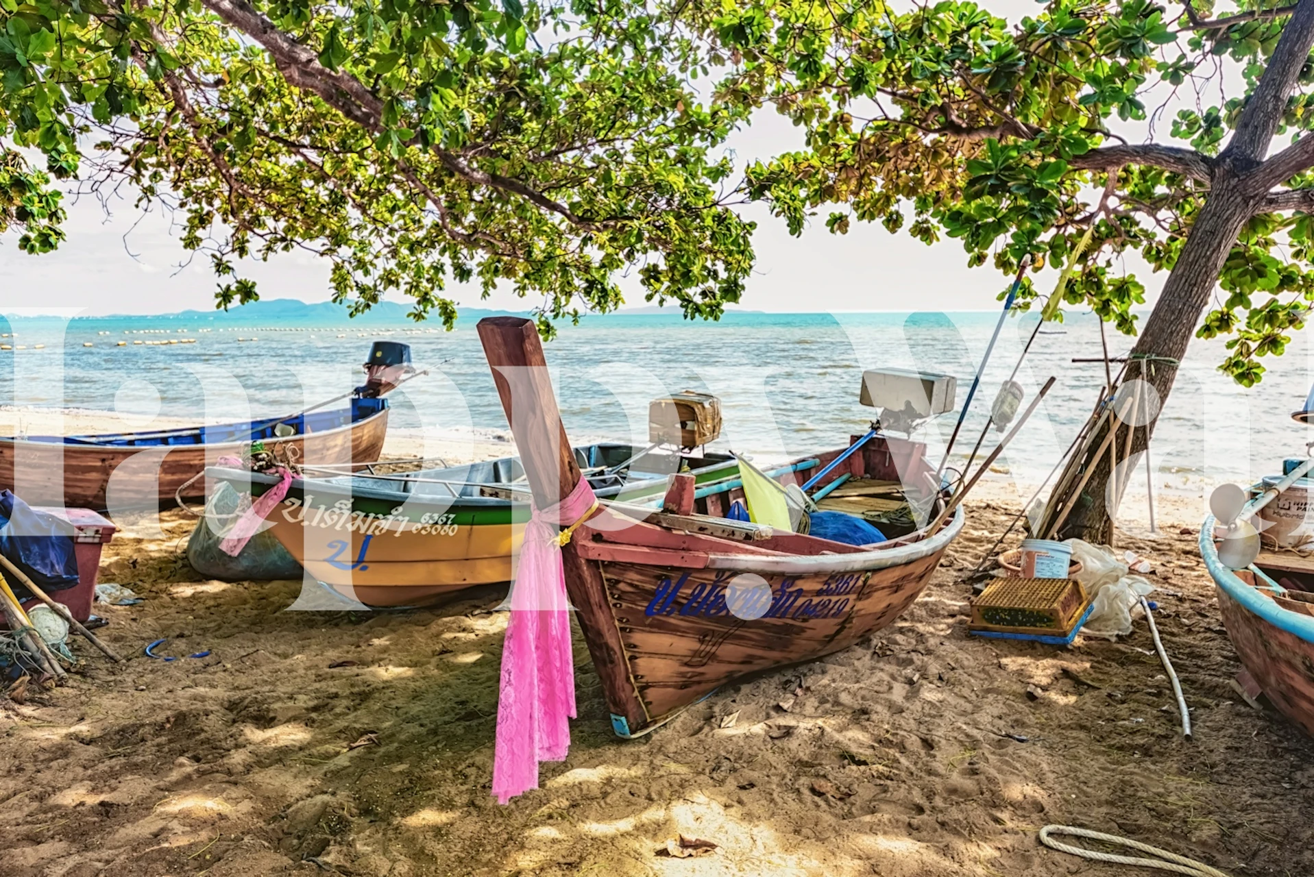 Nautical boat scene with blue and yellow boats in sandy beach setting wallpaper