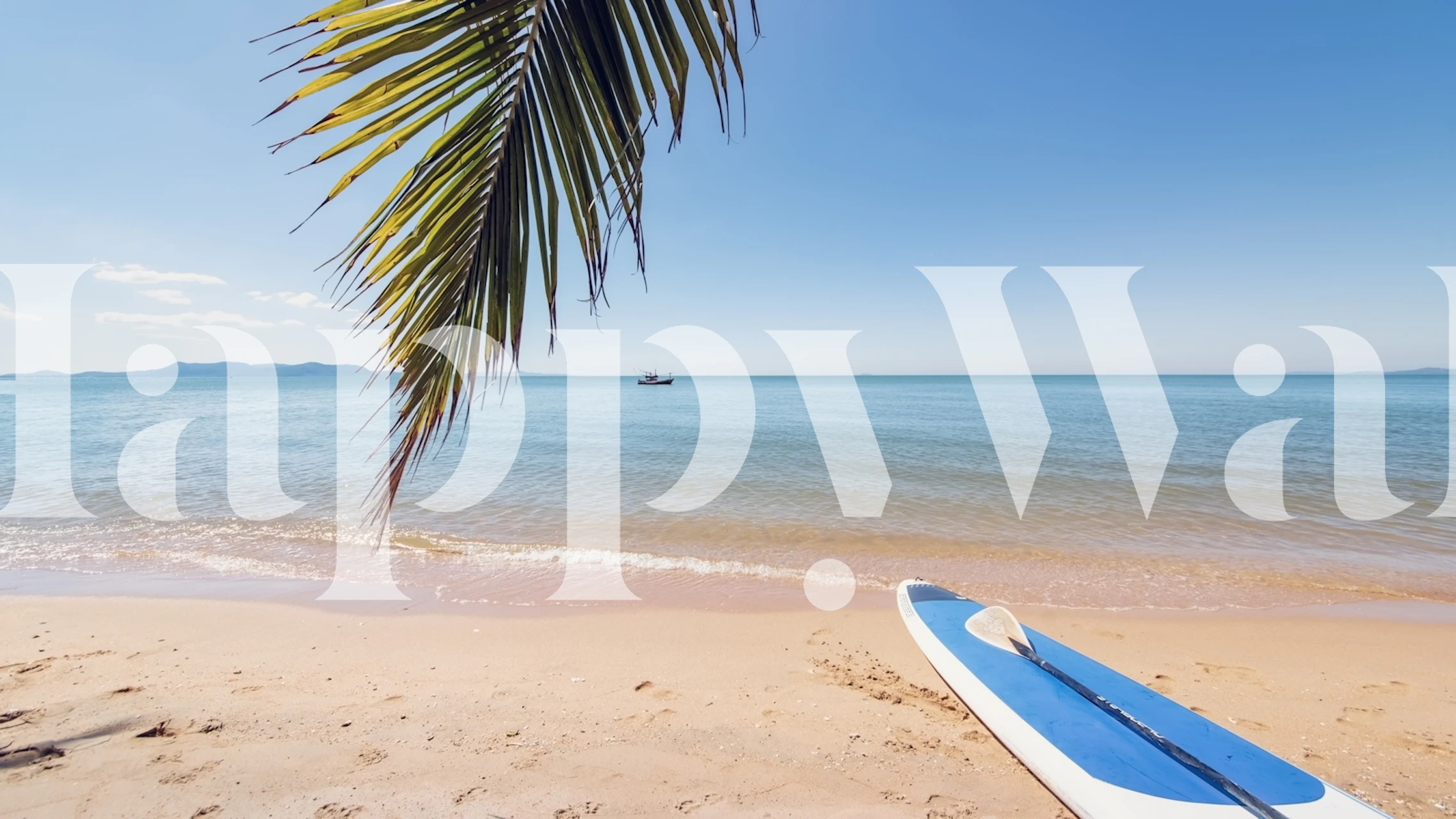 Beach scene with paddleboard, palm leaves, blue water wallpaper