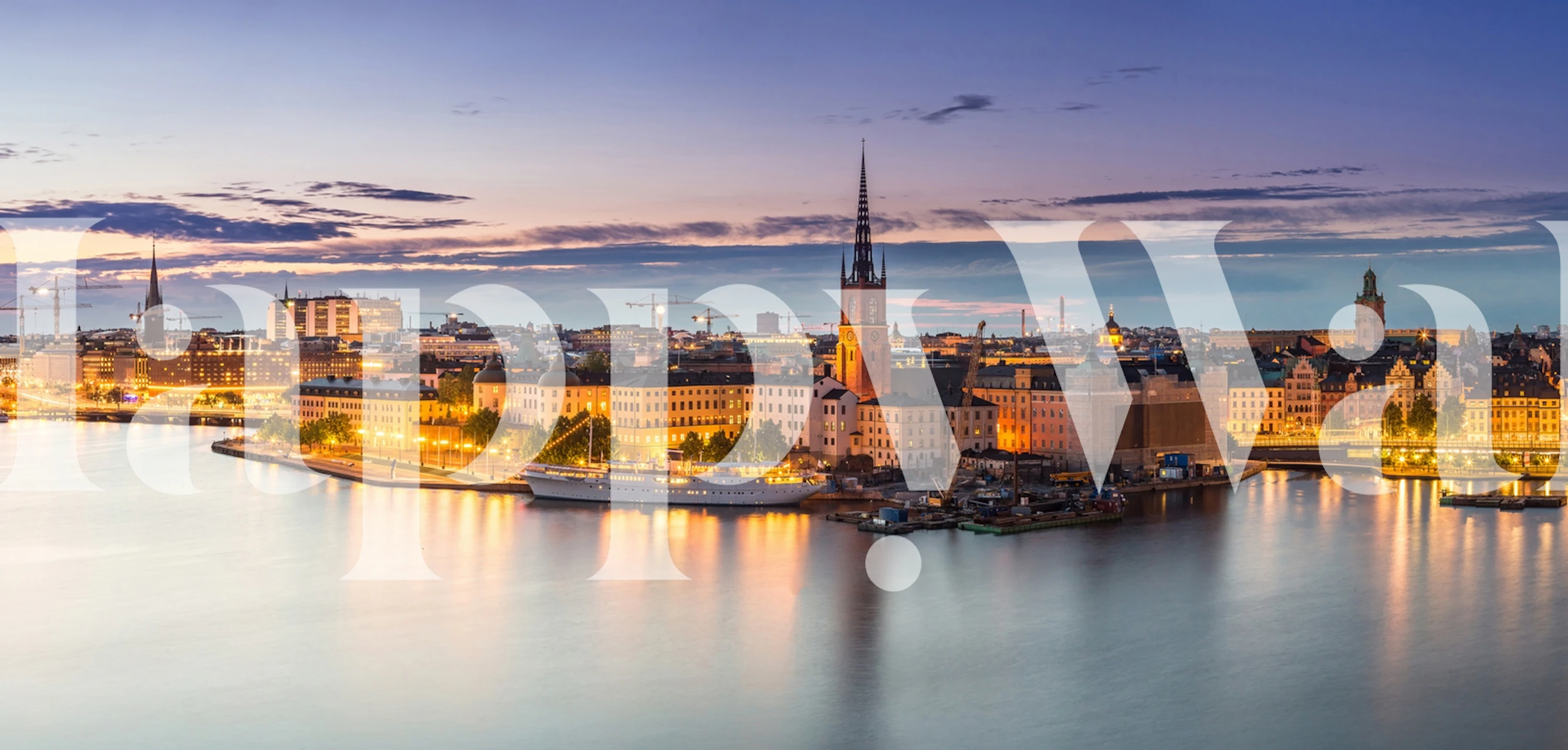 Panoramic view of Stockholm at sunset with city buildings and water wallpaper