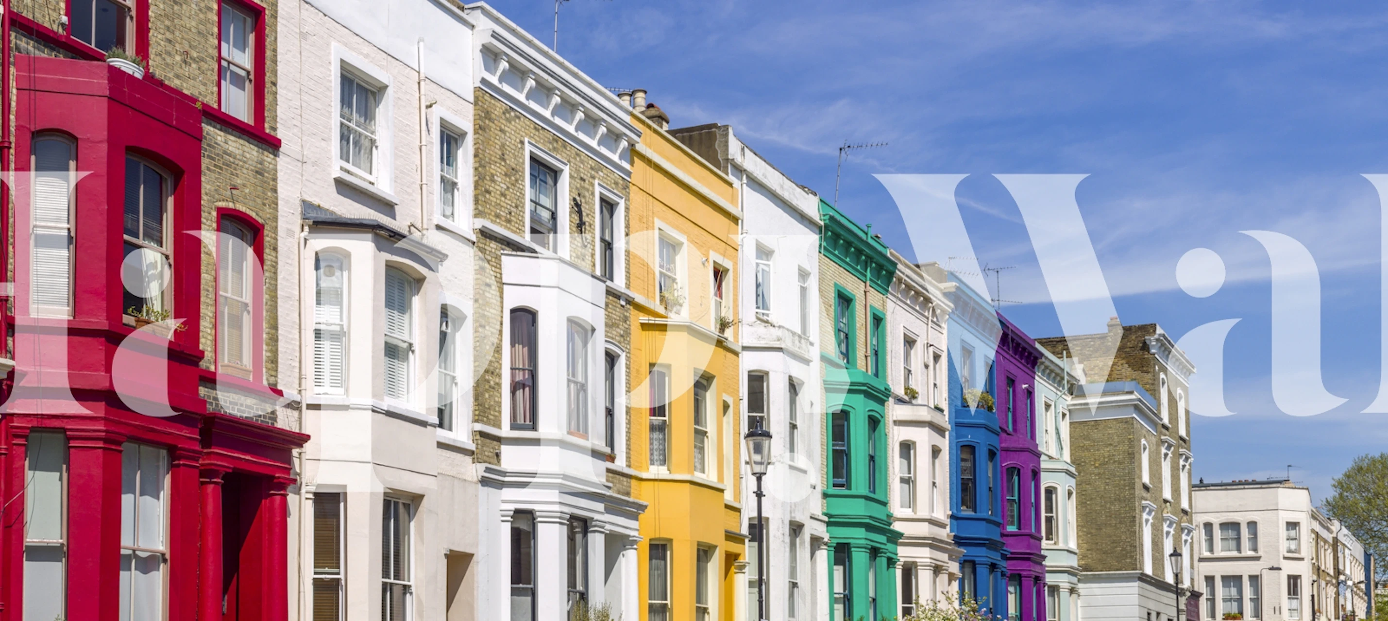 Colorful geometric patterned wallpaper featuring red, yellow, turquoise, and purple houses