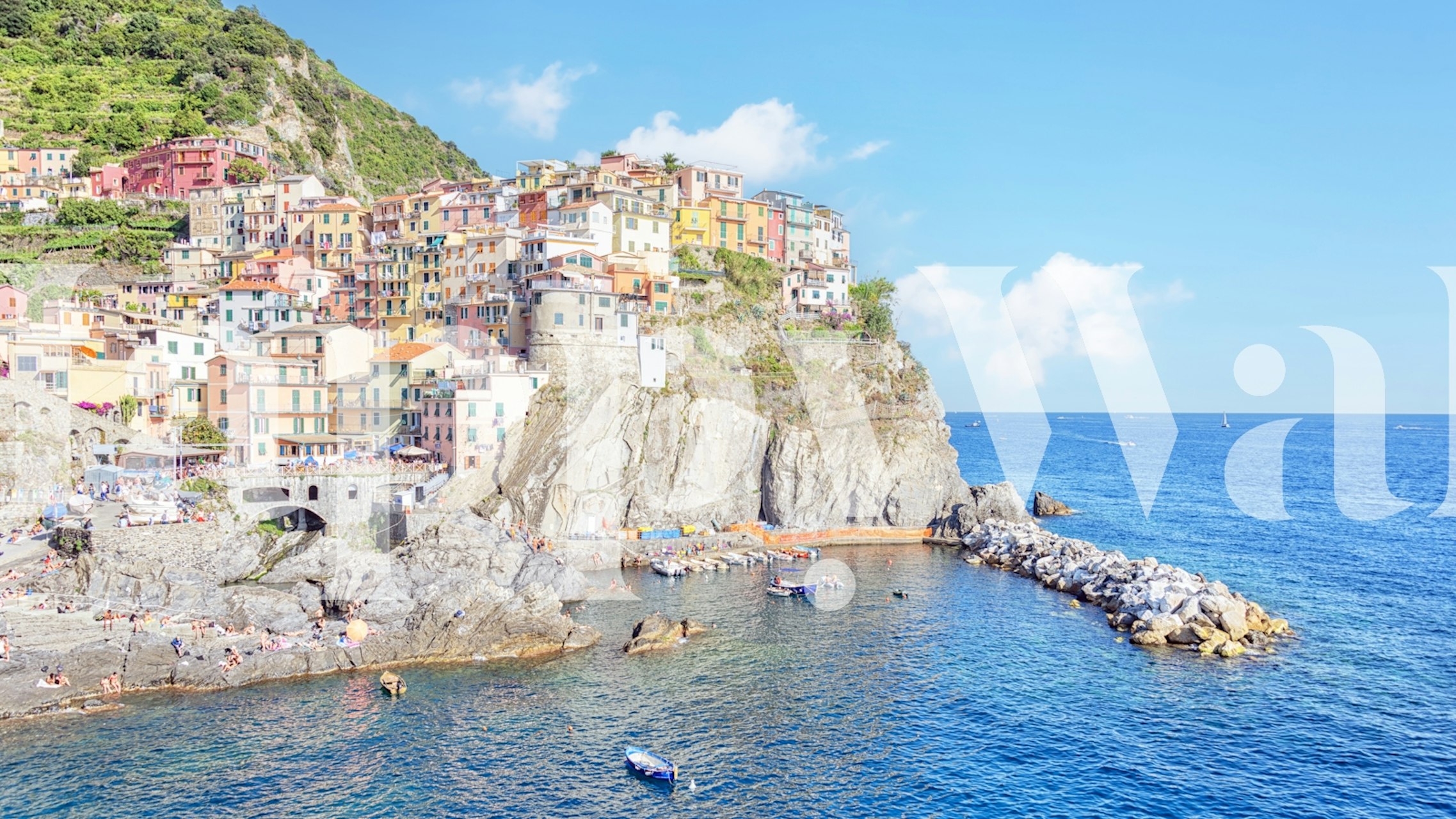 Colorful coastal scenery with bright buildings and blue water wallpaper