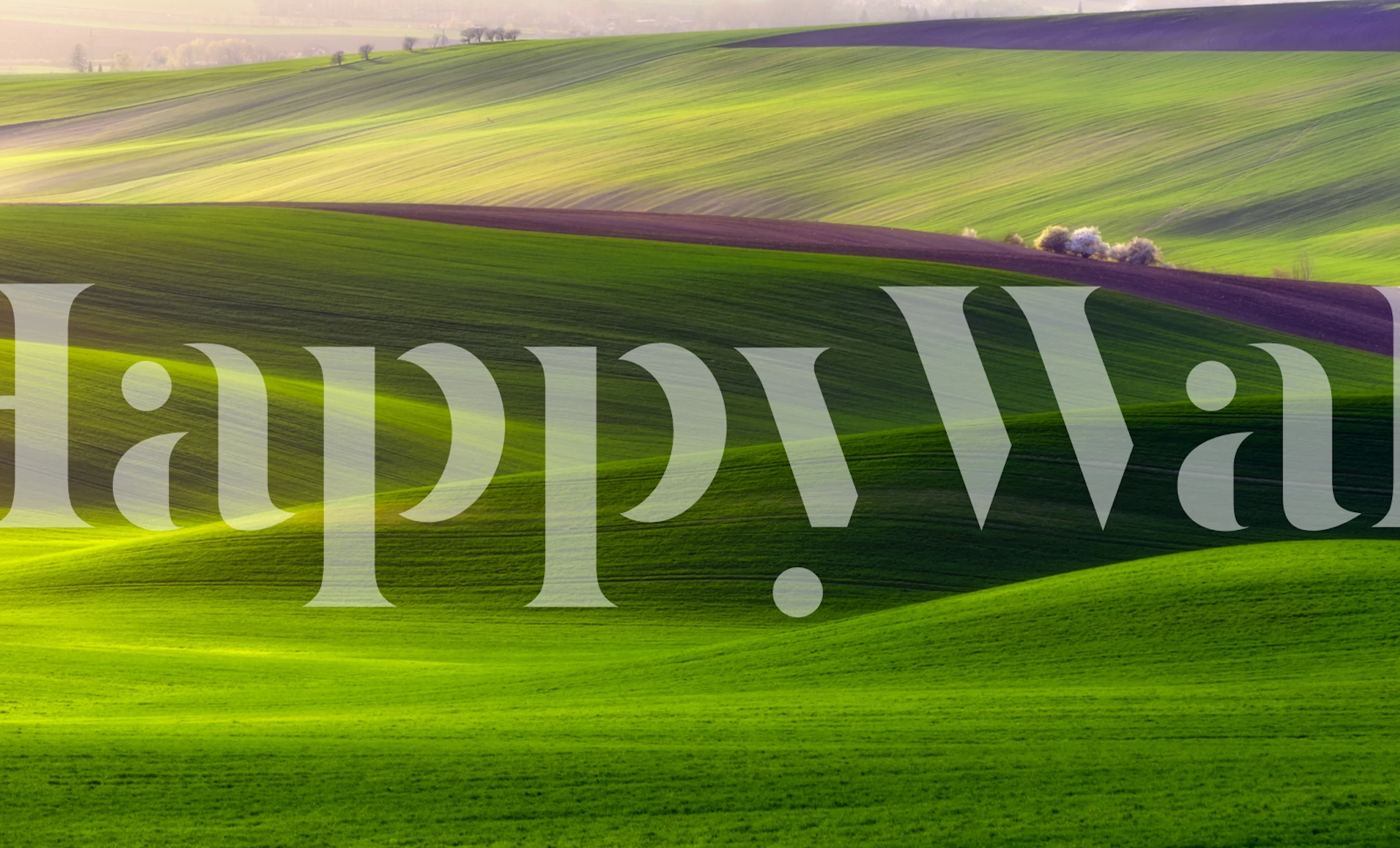 Green landscape wallpaper with rolling hills in soft hues