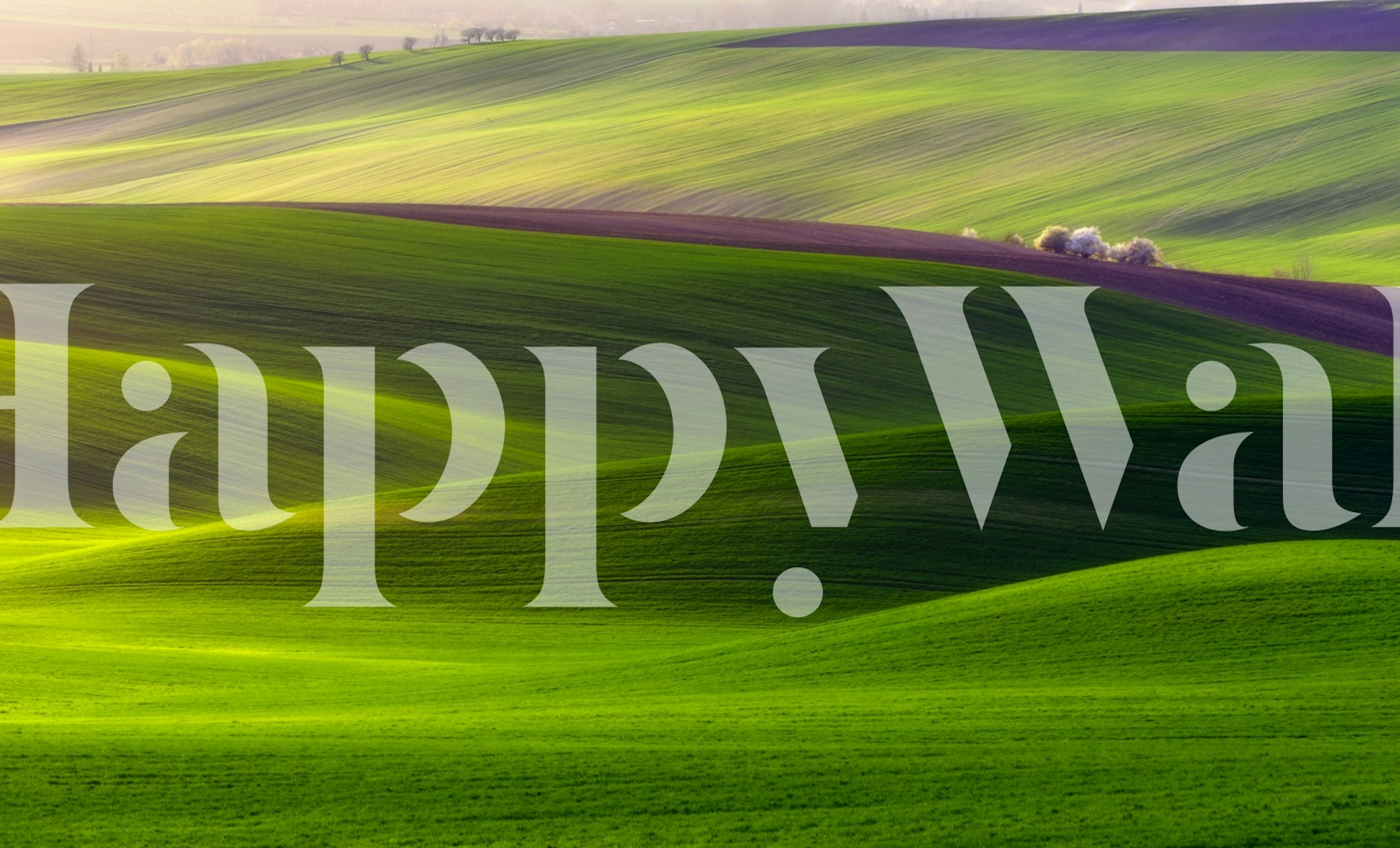 Green landscape wallpaper with rolling hills in soft hues
