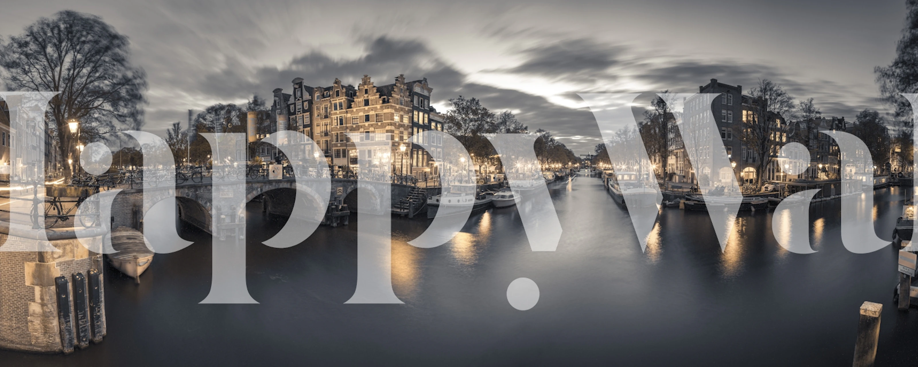 Black and white scene of a canal with illuminated buildings and reflections, scenic wallpaper