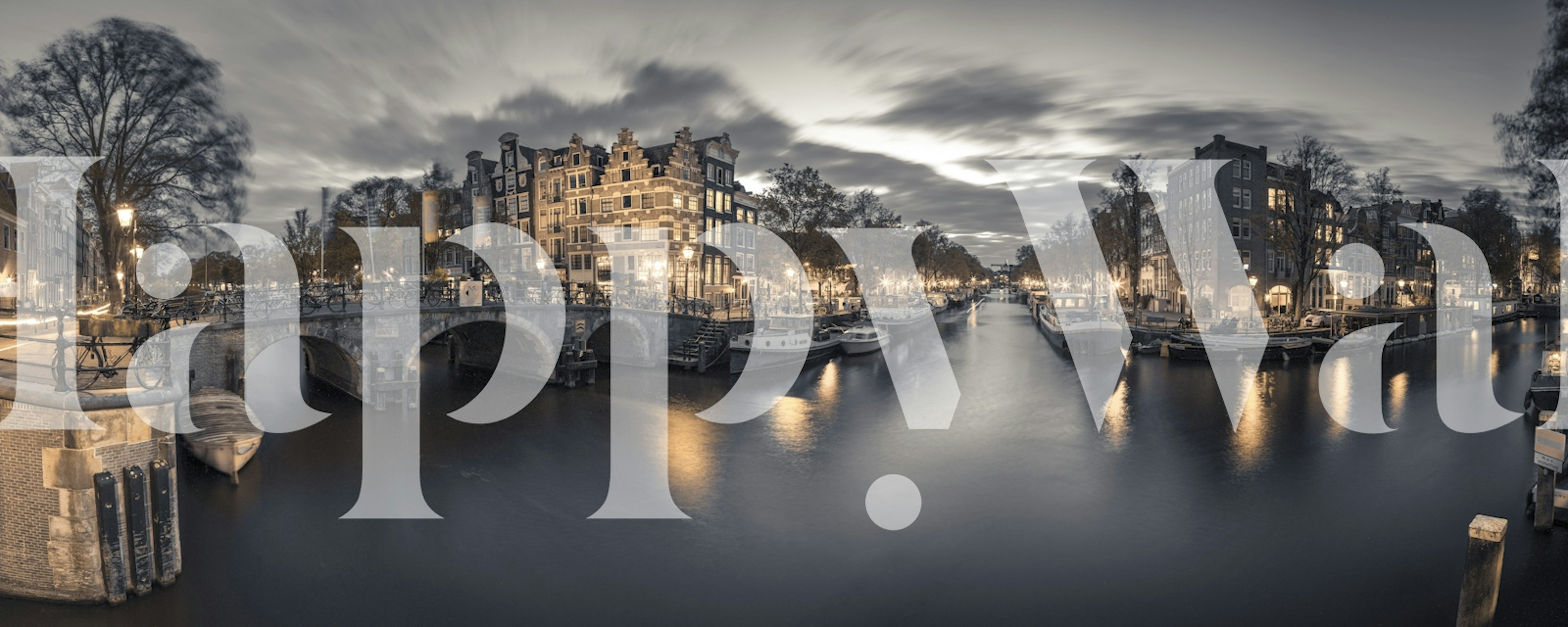 Black and white scene of a canal with illuminated buildings and reflections, scenic wallpaper
