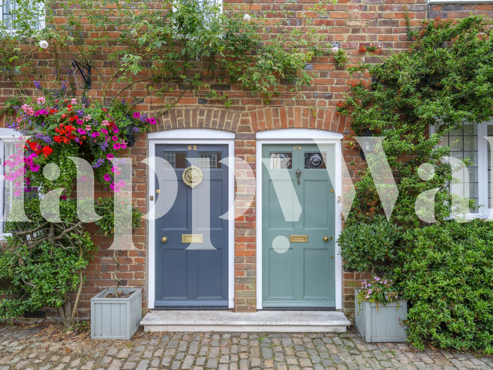 Two doorways with colorful flowers and greenery on brick wall wallpaper