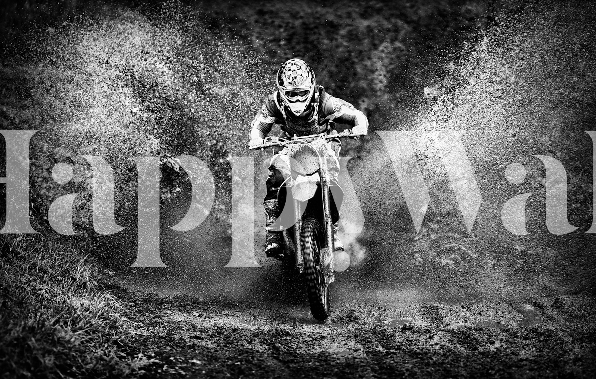 Motorcycle splashing through mud in black and white wallpaper