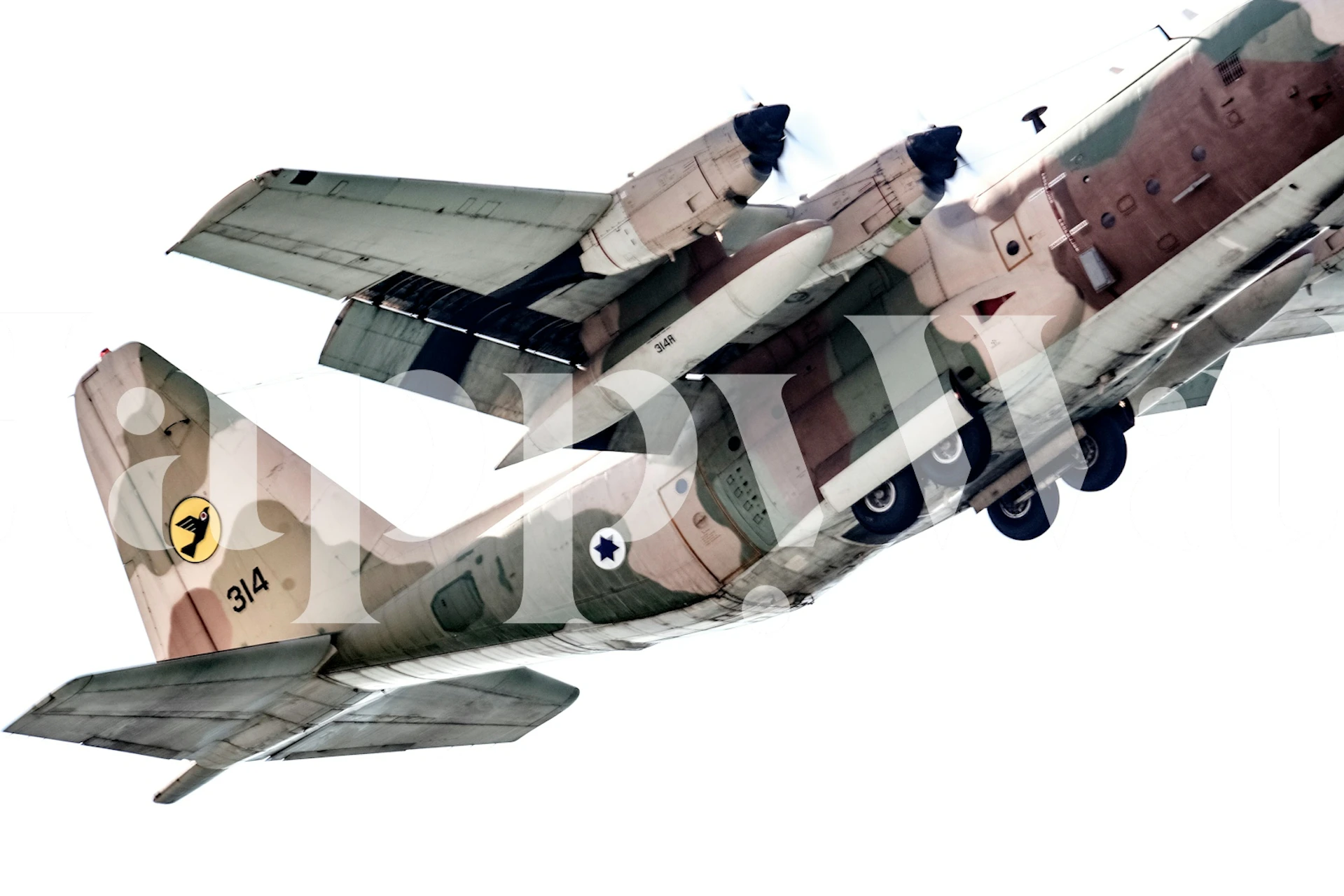 Military aircraft in camouflage colors flying wallpaper