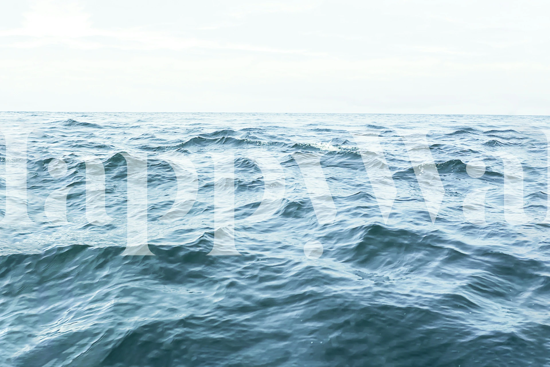 Ocean waves in shades of blue and teal wallpaper